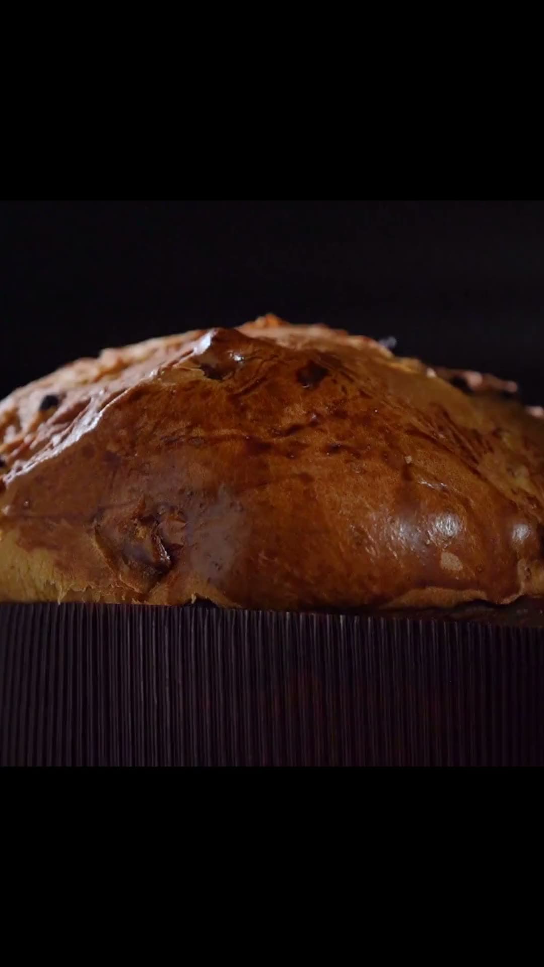 A freshly baked Dacasto panettone turning slowly